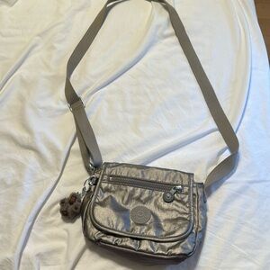 Kipling bag.  Hand for size comparison